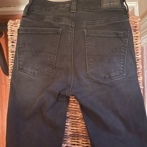 Black distressed skinny jeans size 0 long. By American Eagle